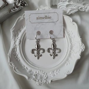 Fleur-De-Lis Huggies Earrings - Silver