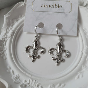 Fleur-De-Lis Huggies Earrings - Silver