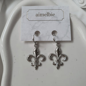 Fleur-De-Lis Huggies Earrings - Silver