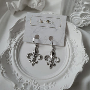 Fleur-De-Lis Huggies Earrings - Silver