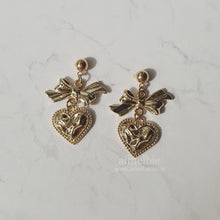 Load image into Gallery viewer, Gold laced heart and bow earrings