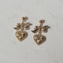 Load image into Gallery viewer, Gold laced heart and bow earrings