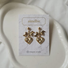 Load image into Gallery viewer, Gold laced heart and bow earrings