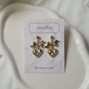 Gold laced heart and bow earrings