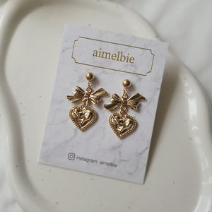 Gold laced heart and bow earrings