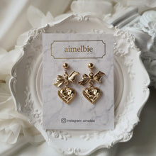 Load image into Gallery viewer, Gold laced heart and bow earrings