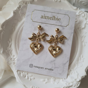 Gold laced heart and bow earrings