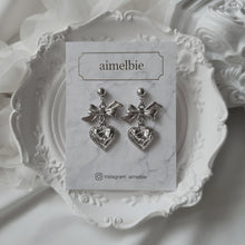 Load image into Gallery viewer, Silver laced heart and bow earrings