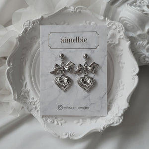 Silver laced heart and bow earrings