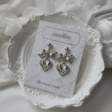 Load image into Gallery viewer, Silver laced heart and bow earrings