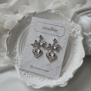 Silver laced heart and bow earrings