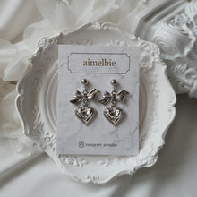 Load image into Gallery viewer, Silver laced heart and bow earrings