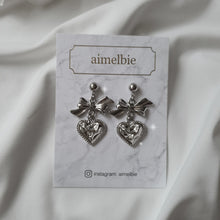 Load image into Gallery viewer, Silver laced heart and bow earrings