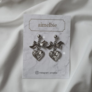 Silver laced heart and bow earrings