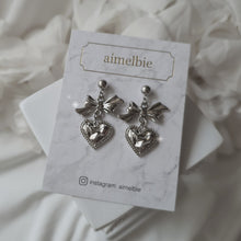 Load image into Gallery viewer, Silver laced heart and bow earrings