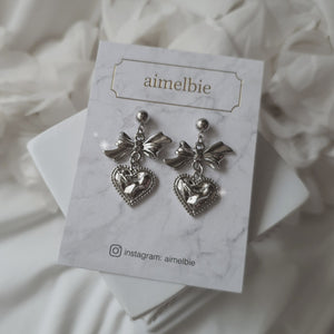 Silver laced heart and bow earrings