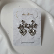 Load image into Gallery viewer, Silver laced heart and bow earrings