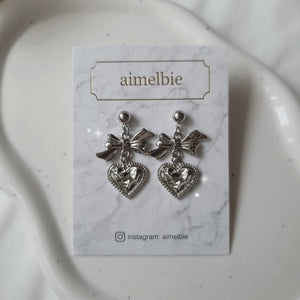 Silver laced heart and bow earrings