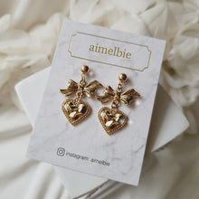 Load image into Gallery viewer, Gold laced heart and bow earrings