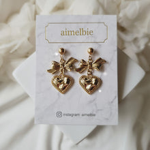 Load image into Gallery viewer, Gold laced heart and bow earrings