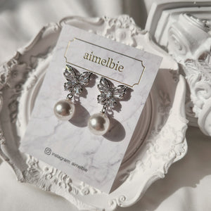 Butterfly and pearl earrings